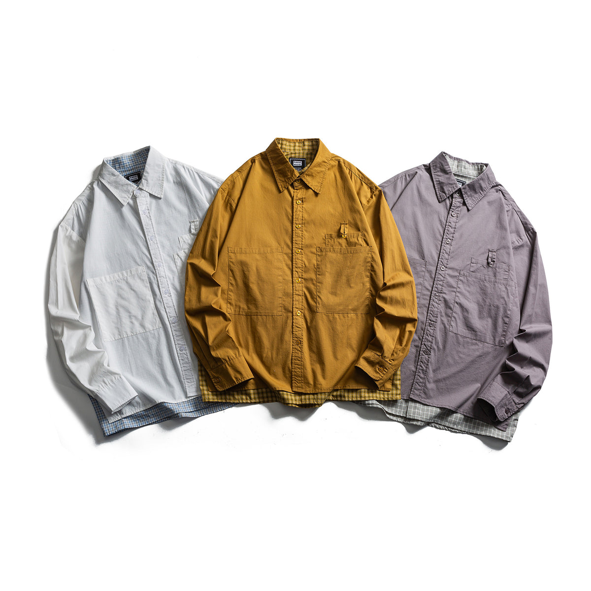 Splicing fake two loose casual workwear long sleeved shirts